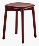 A front angle view of the Soft Edge low Stool in red.