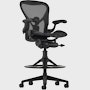 Black matte Aeron Stool on a white background with a 5-star base and ergonomic back support, angled view of the stool front.
