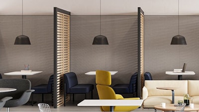 A group of yellow HAY Uchiwa Lounge Chairs in front of large floor-to-ceiling windows used in a community café setting to reduce social isolation and enhance belonging