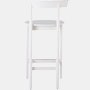 A white counter-height Comma Stool, viewed from the back.