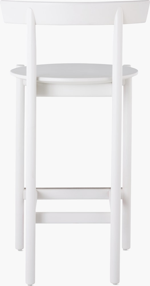 A white counter-height Comma Stool, viewed from the back.