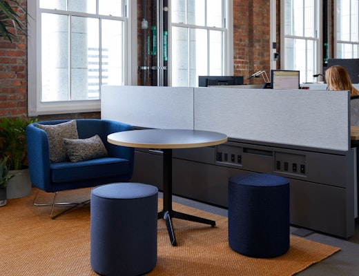 Rockwell Unscripted Club Chair and Upholstered Seat with Dividends Horizon X Base Table and Antenna Fence rockwell unscripted club chair and ottoman dividends horizon x base table knoll san francisco showroom welcoming community essentials