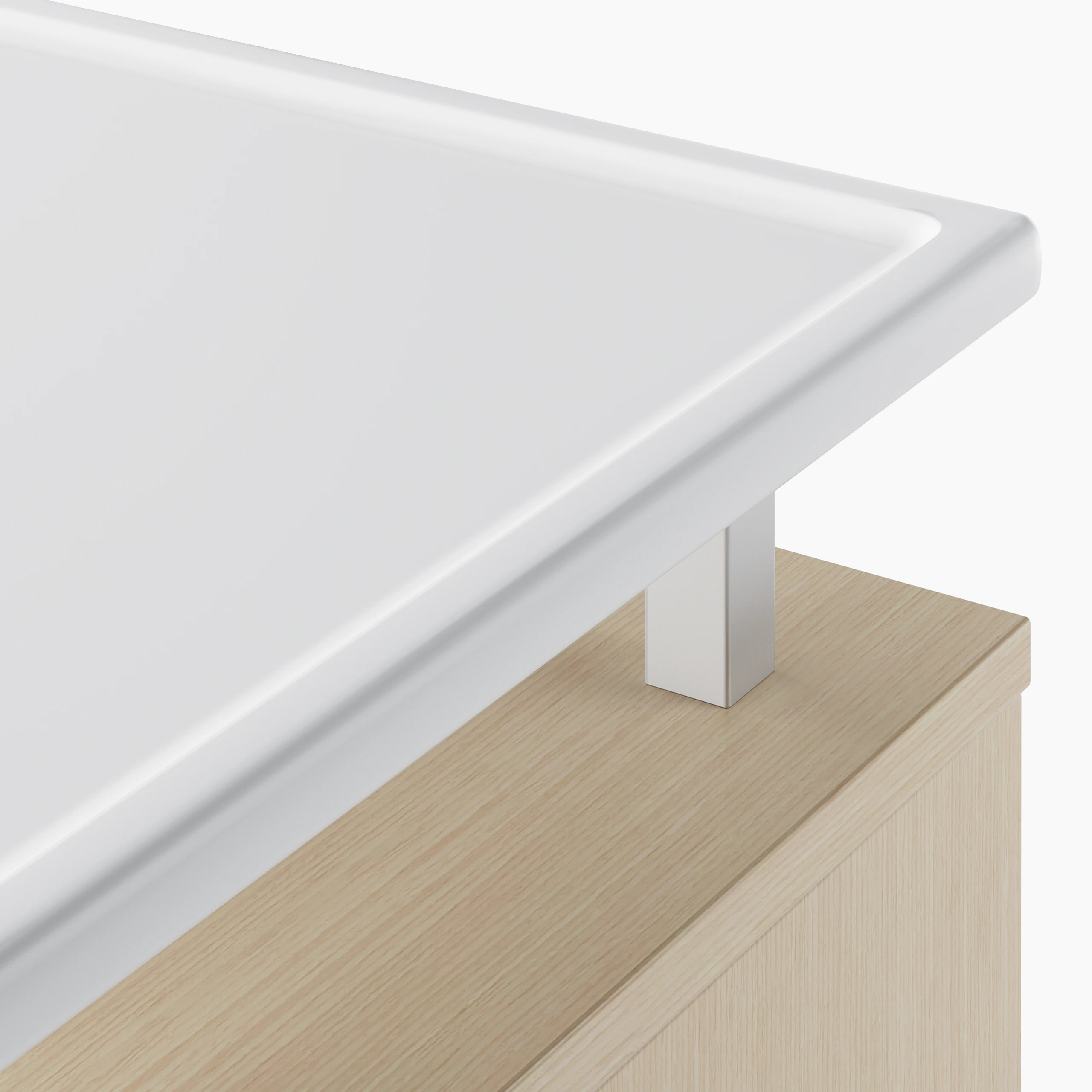 A detail of the Nemschoff Bedside Cabinet raised top in a white Corian on an ash laminate cabinet.