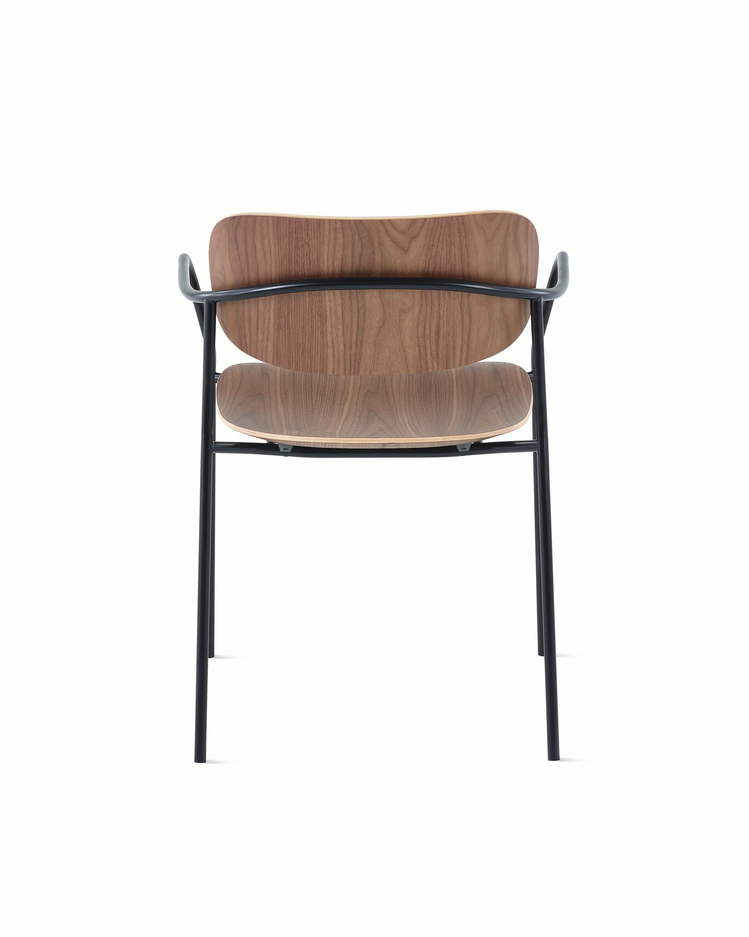 Portrait Chair with Walnut seat and back, and black frame with arms.