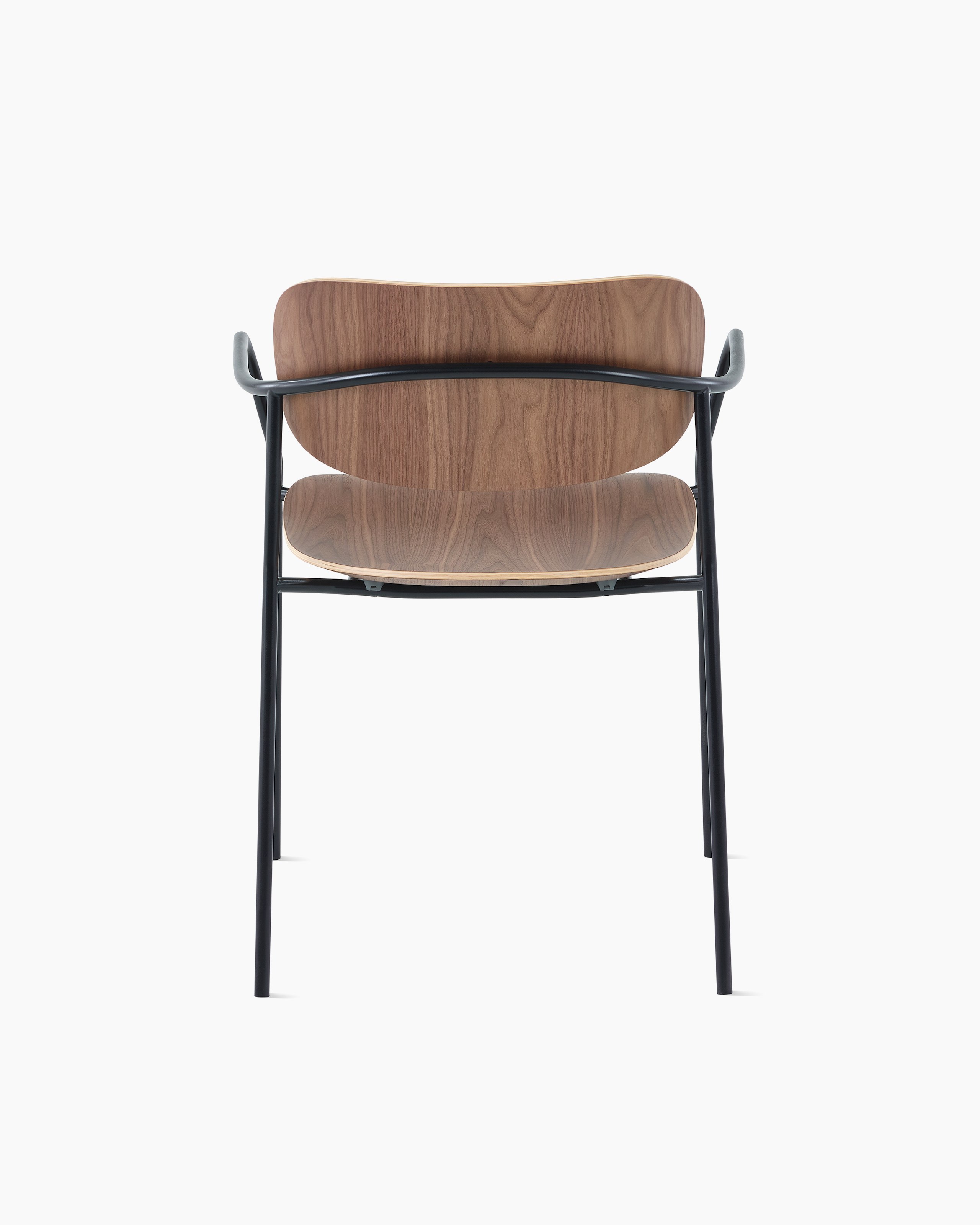 Portrait Chair with Walnut seat and back, and black frame with arms.