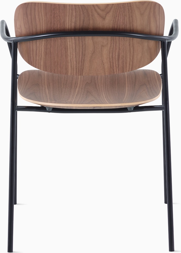 Portrait Chair with Walnut seat and back, and black frame with arms.