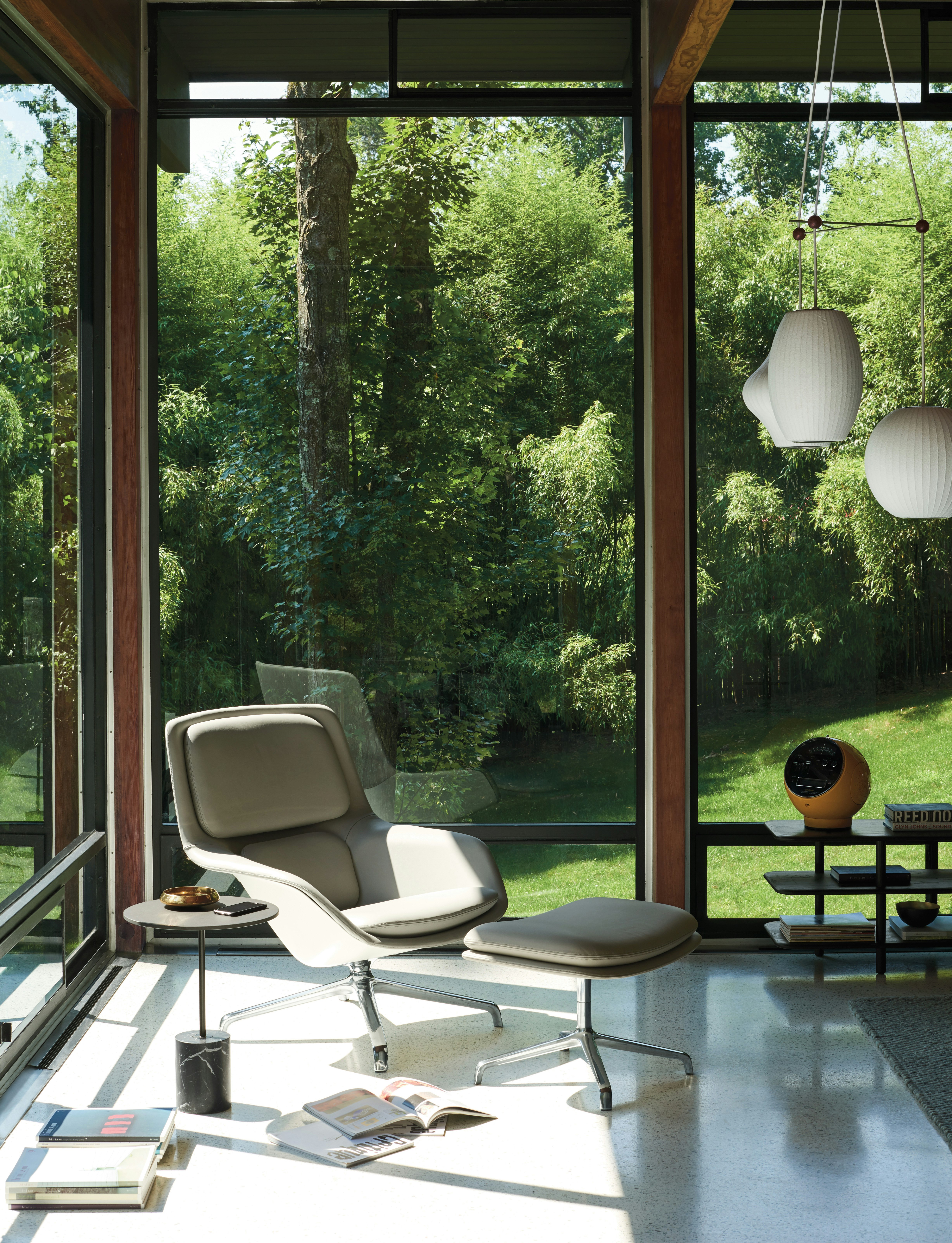 Striad Lounge Chair and Ottoman in a living room setting