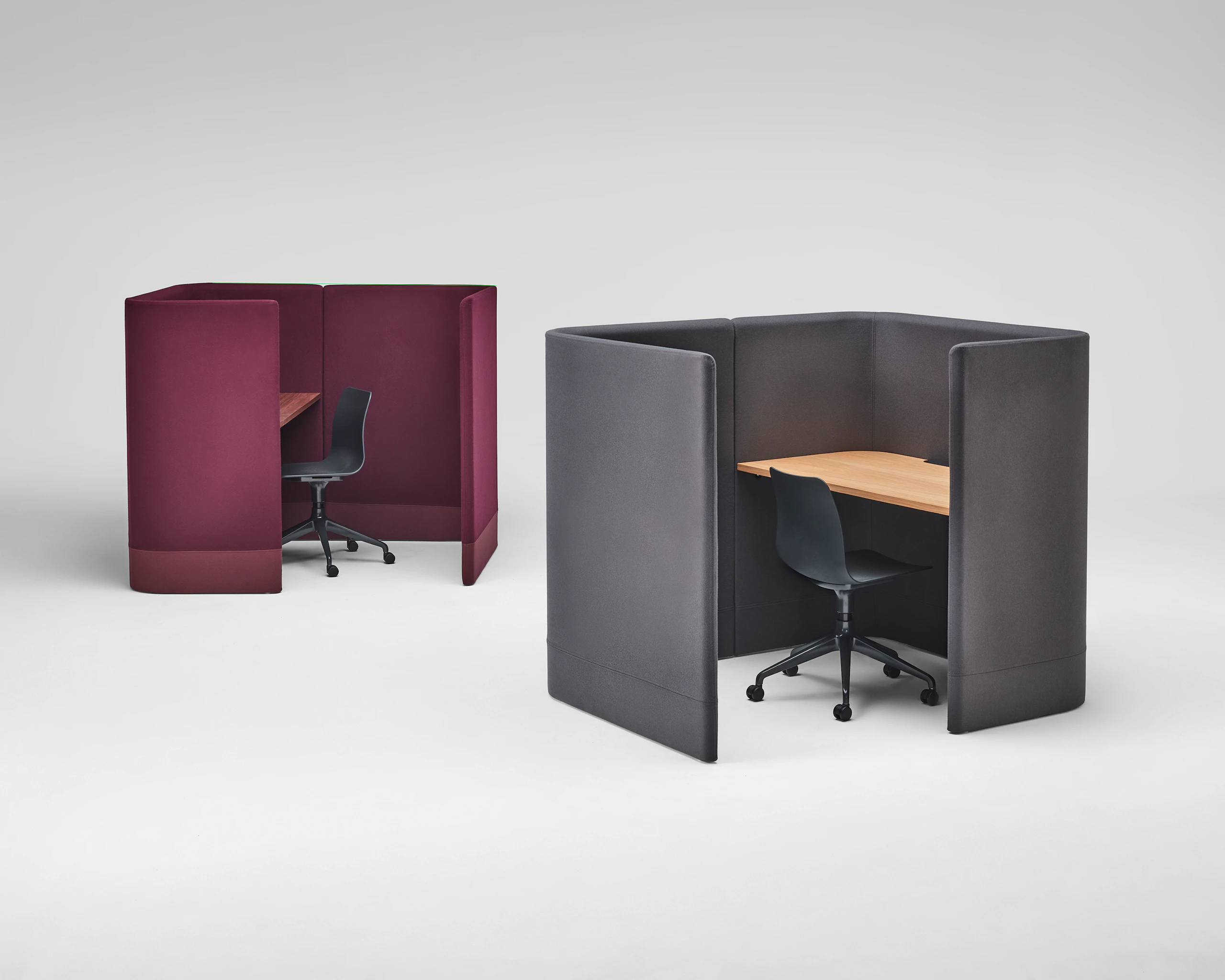 Burgundy Pullman Desk Pod with black Polly chair, sitting next to grey Pullman Desk Pod with black Polly chair.