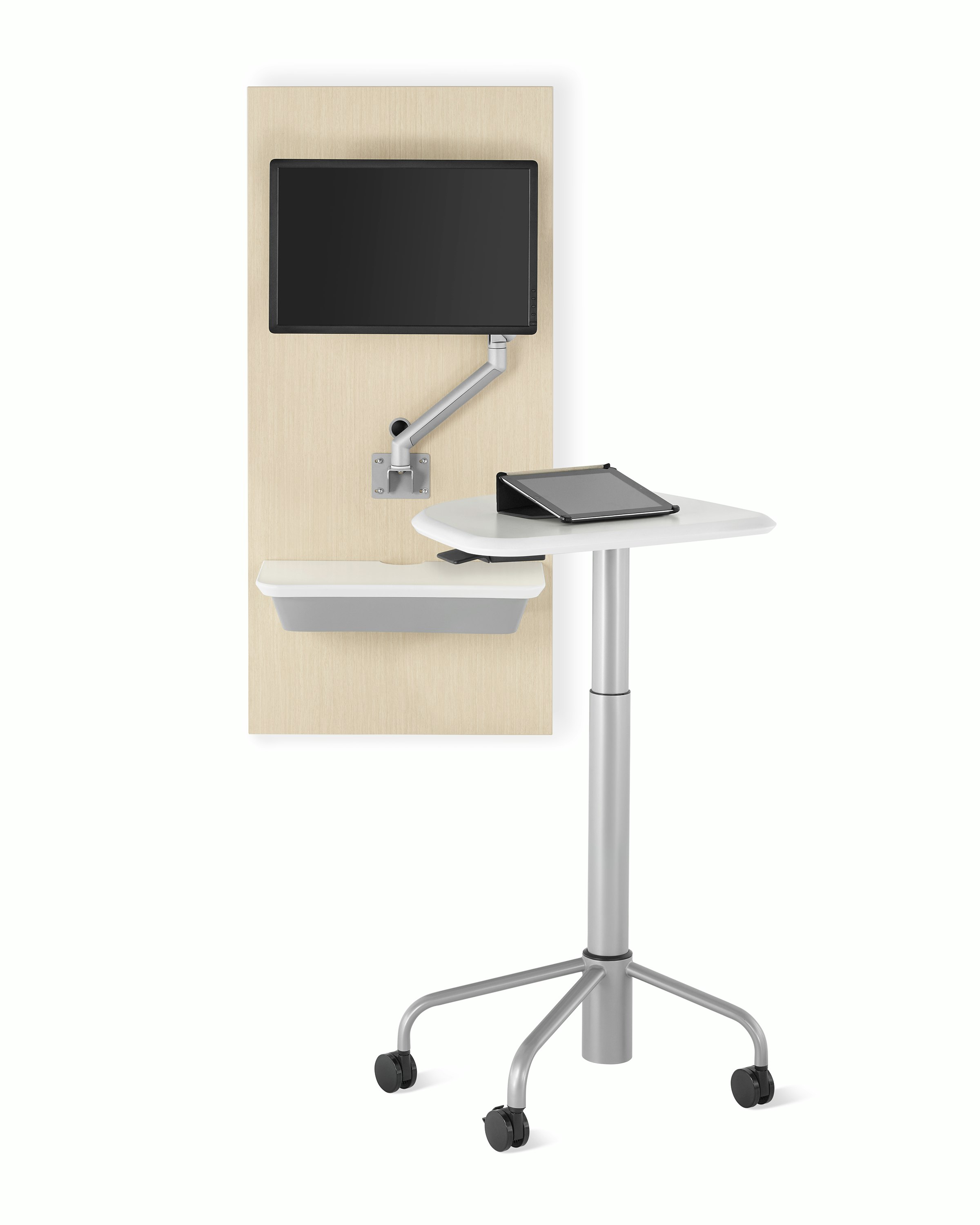 An Intent Solution technology support wall unit in an ash wood finish with an Intent Solution mobile, height-adjustable table.