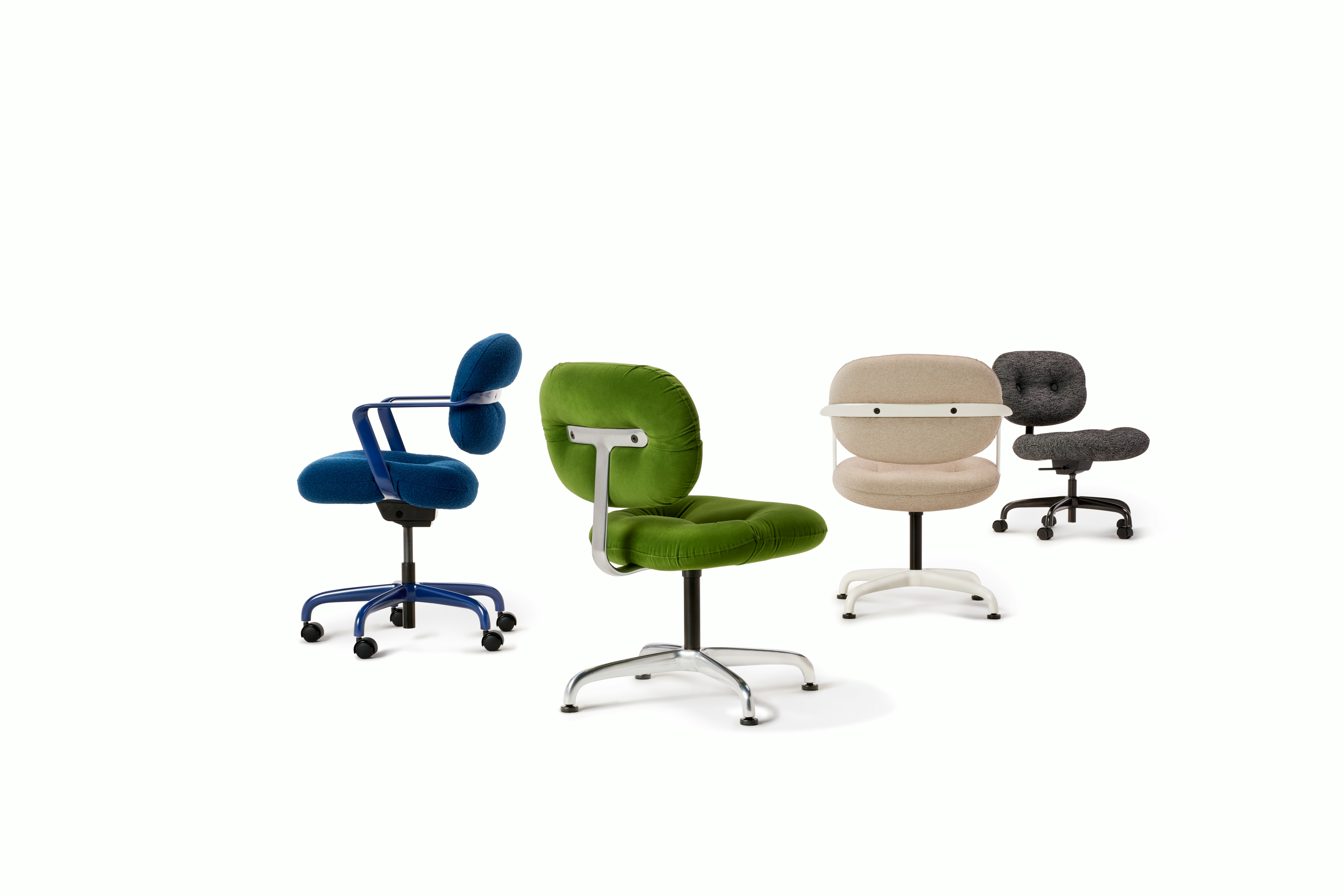 A group of four Morrison Hannah Chairs with various colors and materials.  There are two office chairs and two side chairs.