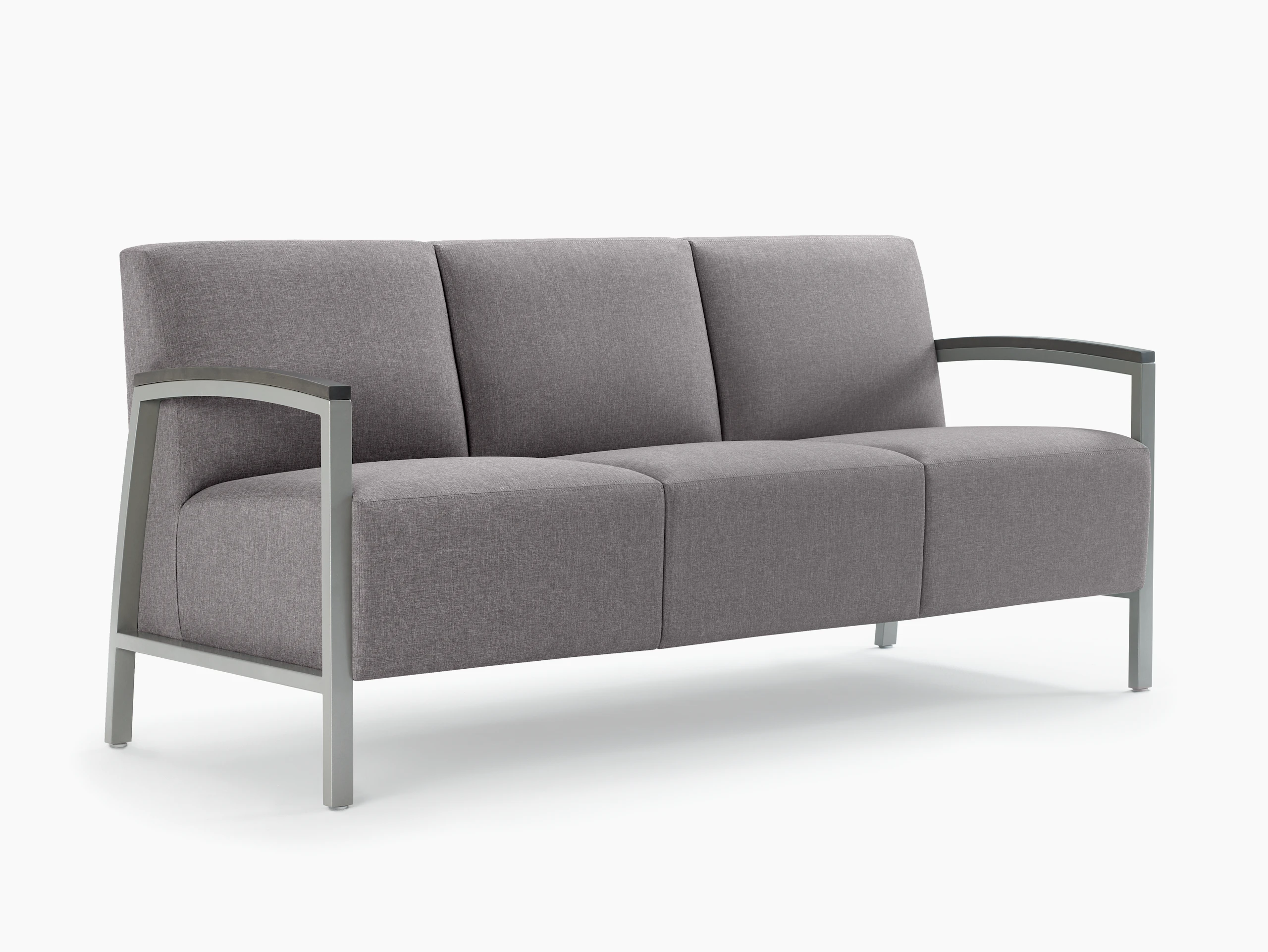 Front three-quarter view of a gray Brava Modern Lounge three-seat sofa with wood arm caps.