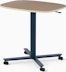 Large Passport Work Table with light woodgrain surface and dark blue base on casters.