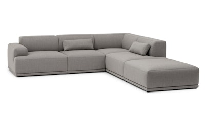A front three quarter view of a grey Connect Sofa by Muuto