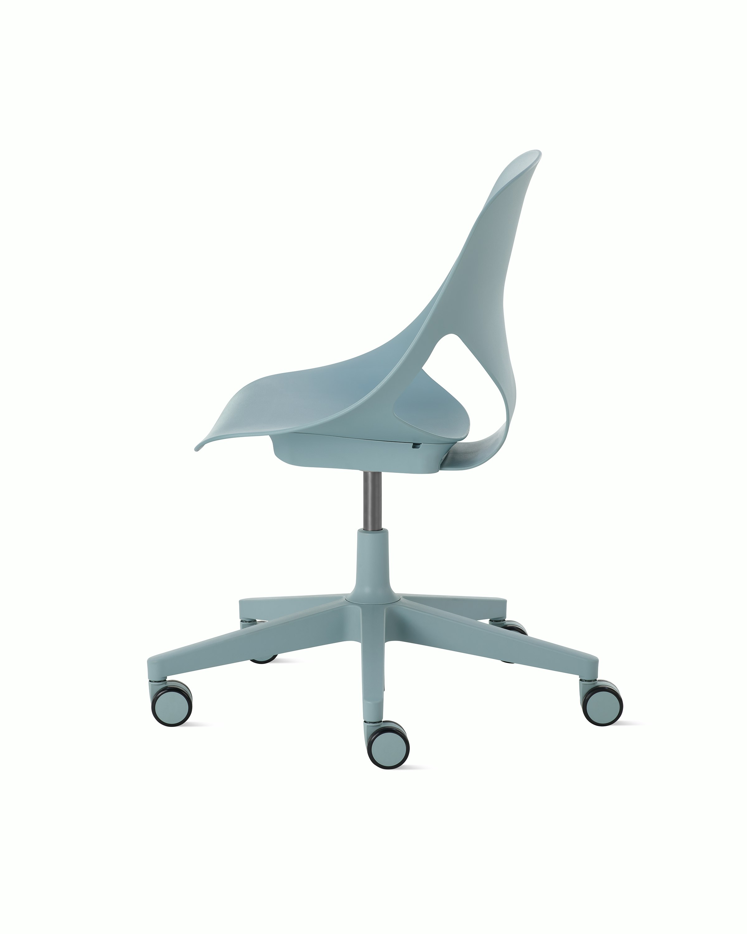 Side view of a light blue armless Zeph chair.