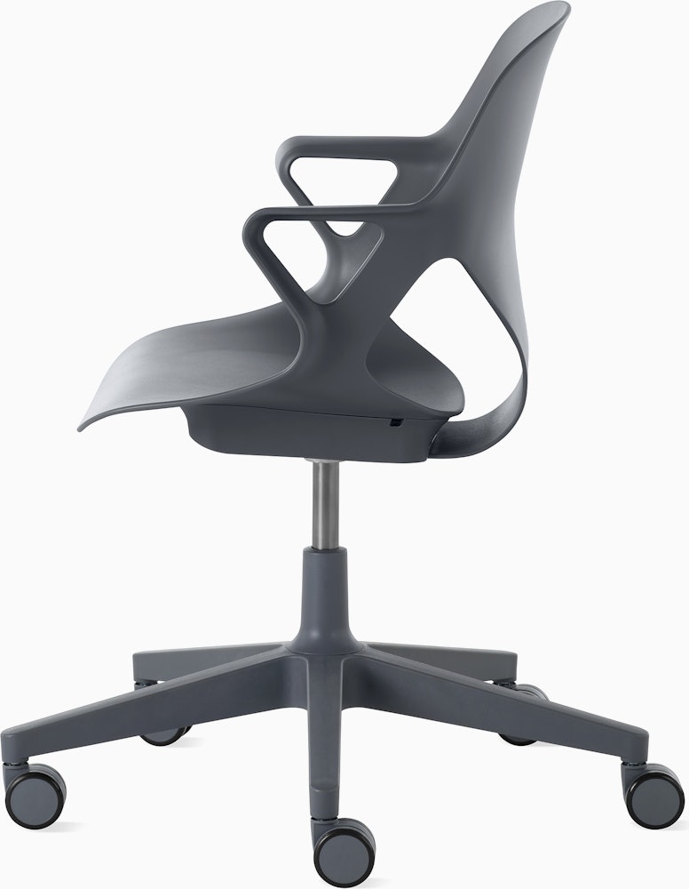 Side  view of a Zeph chair with fixed arms in dark grey.