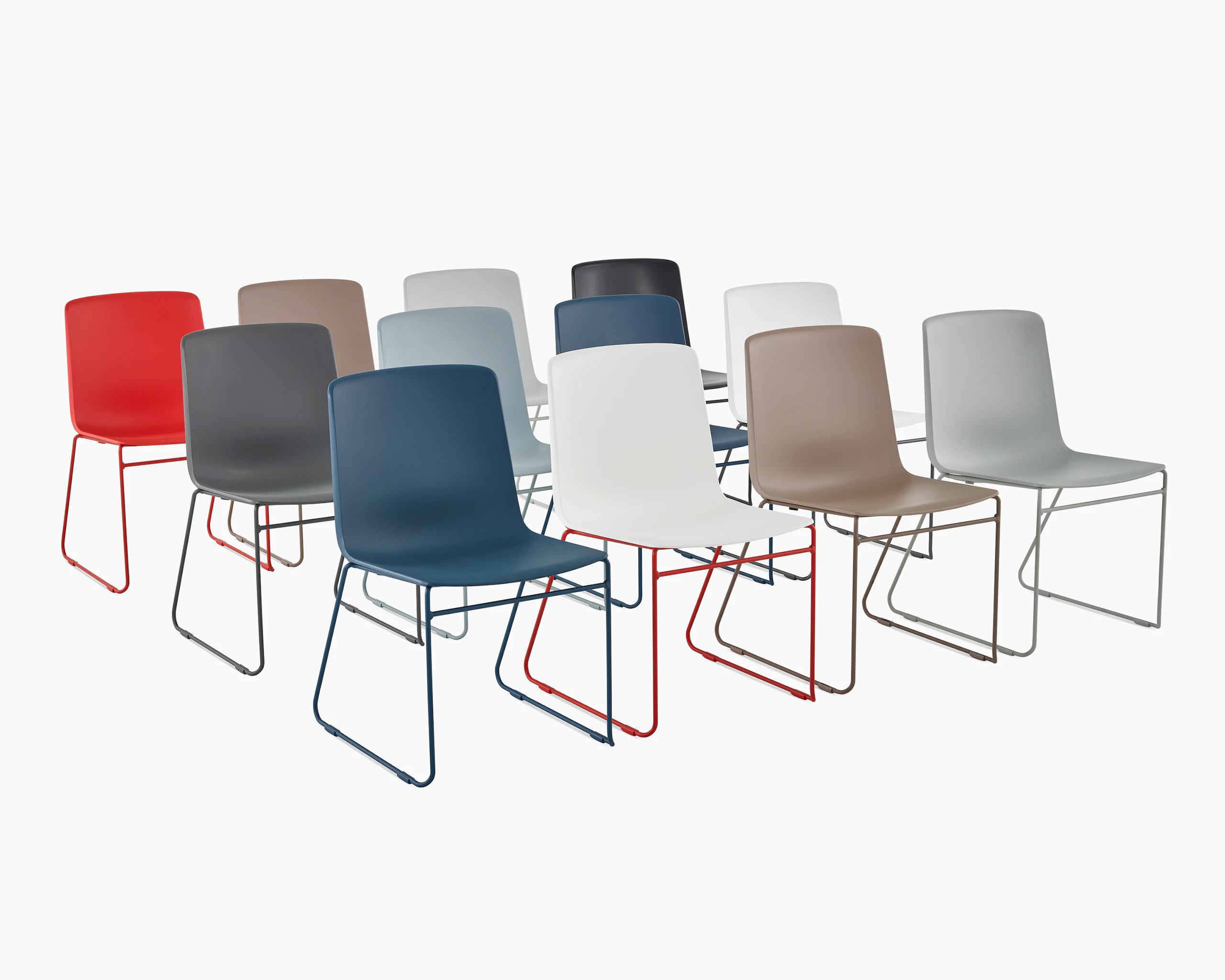 Three rows of multi colored Pronta Stacking Chairs.