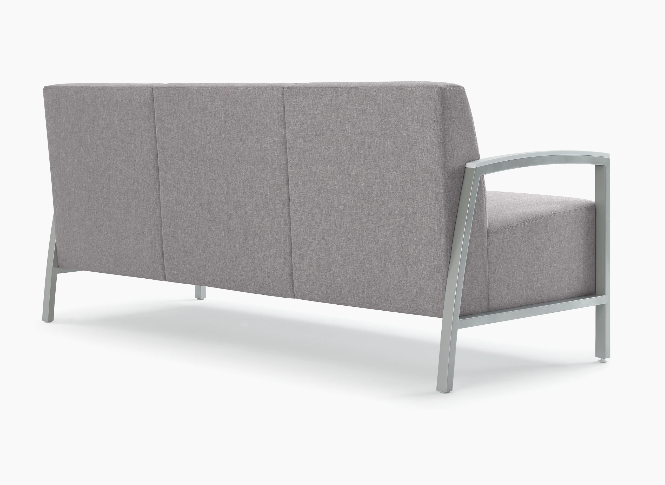 Back three-quarter view of Brava Modern Lounge Seating (three seat) with solid surface arm caps.