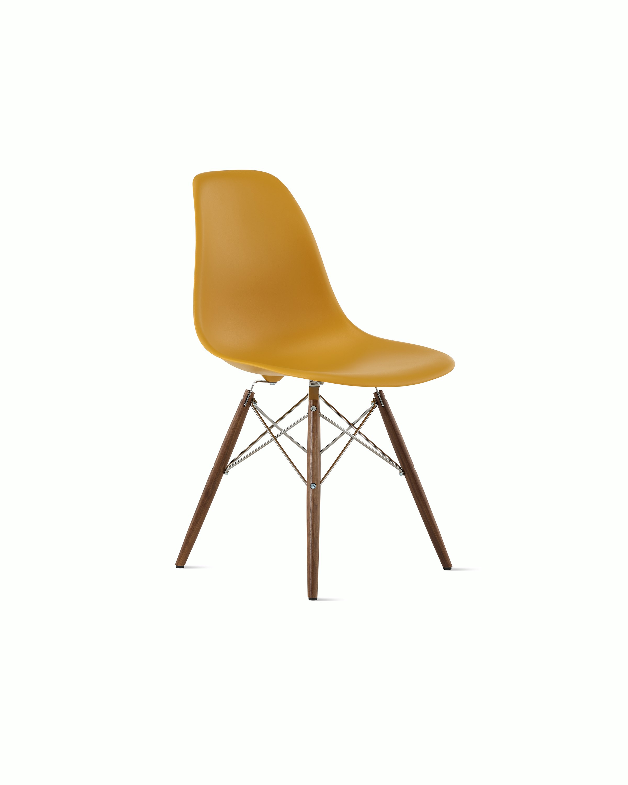 Front of deep yellow plastic shell chair on dowel-base legs.