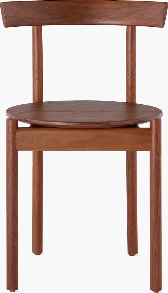 A walnut Comma Chair, viewed from the front.