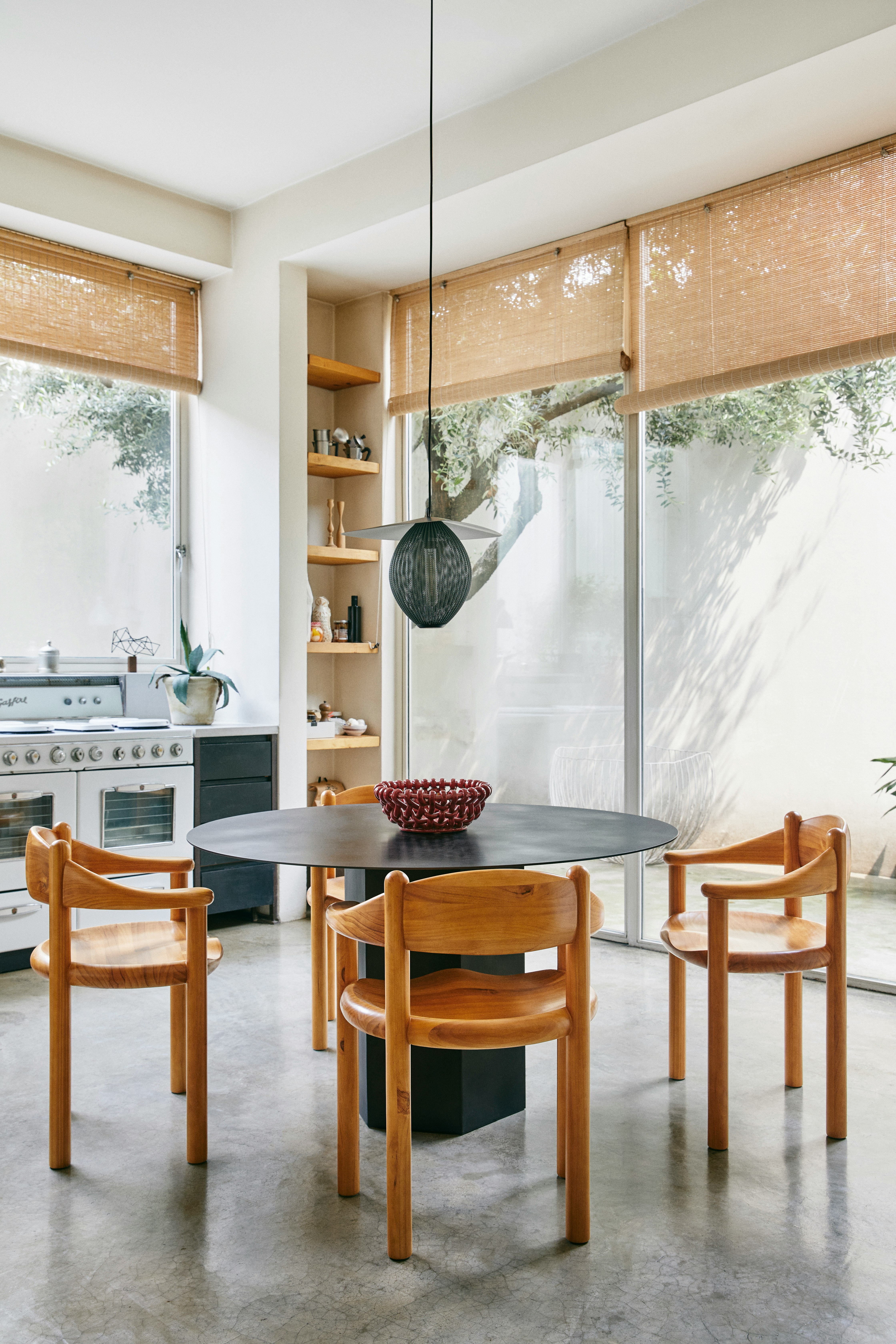 Daumiller Chairs around a Saarinen Dining Table in a dining room setting