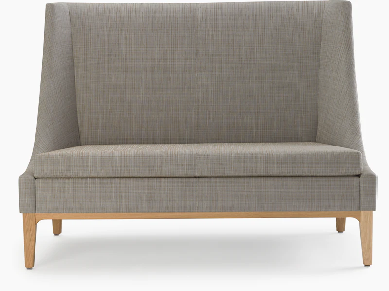 Nemschoff Iris Settee in a gray upholstery and light wood base and legs, viewed from the front.