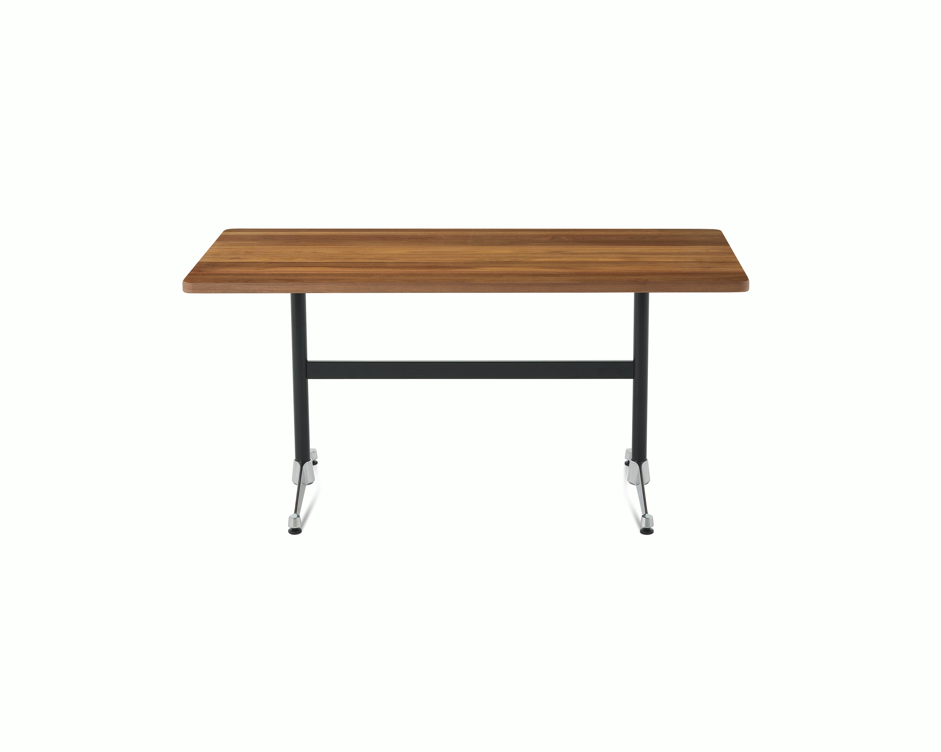 An Eames T-Leg table with a walnut top, black legs, and chrome feet. 