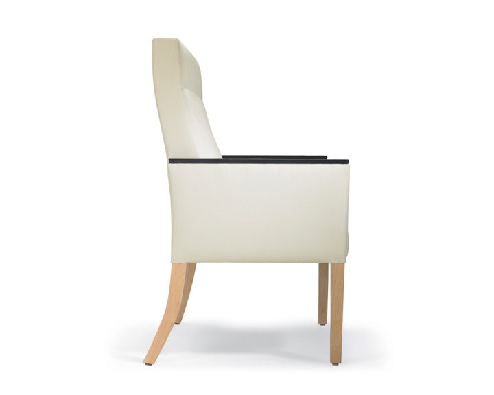 A side view of a Brava 862 Plus Chair with high-back in white textile with urethane arm caps and maple base.