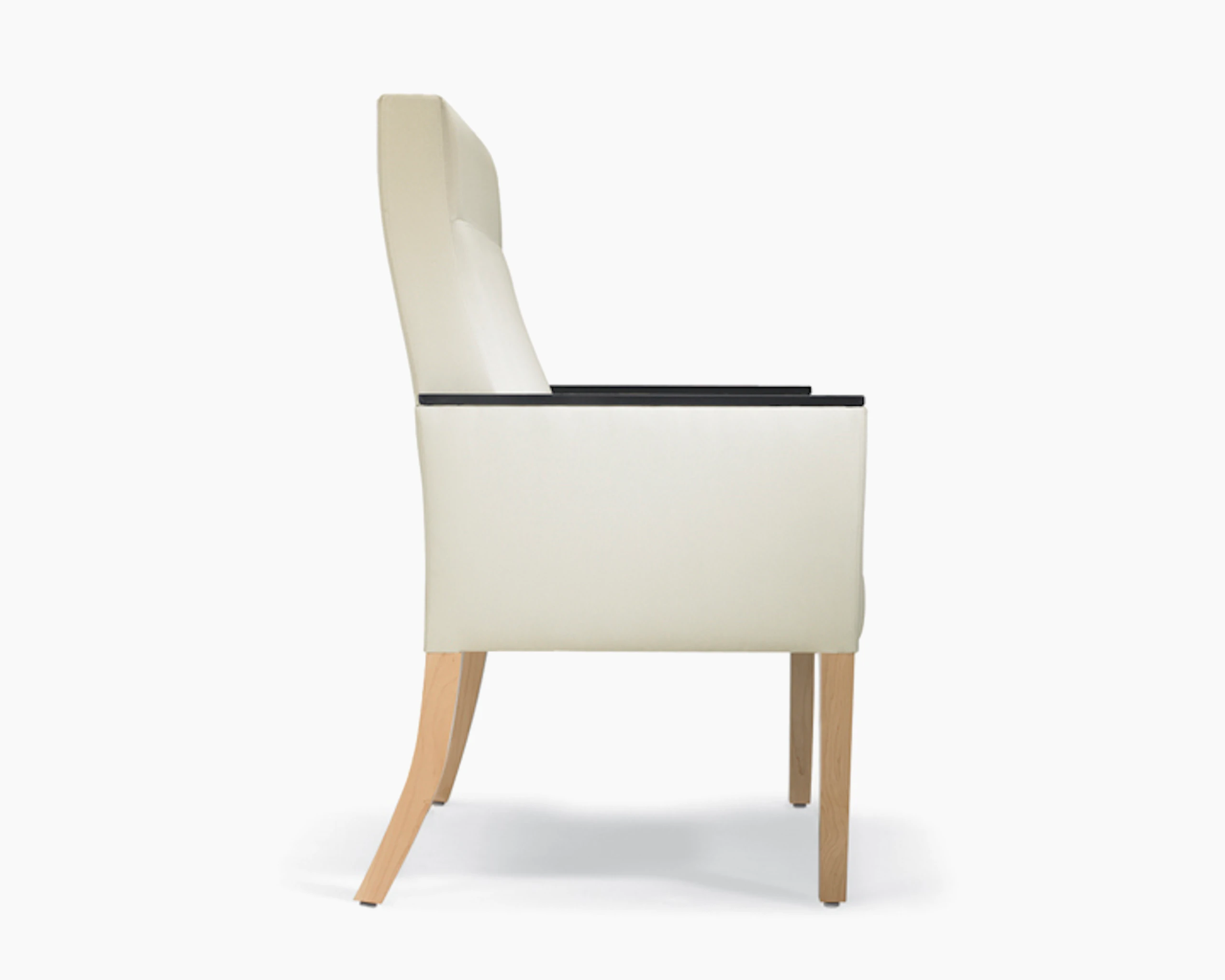 A side view of a Brava 862 Plus Chair with high-back in white textile with urethane arm caps and maple base.