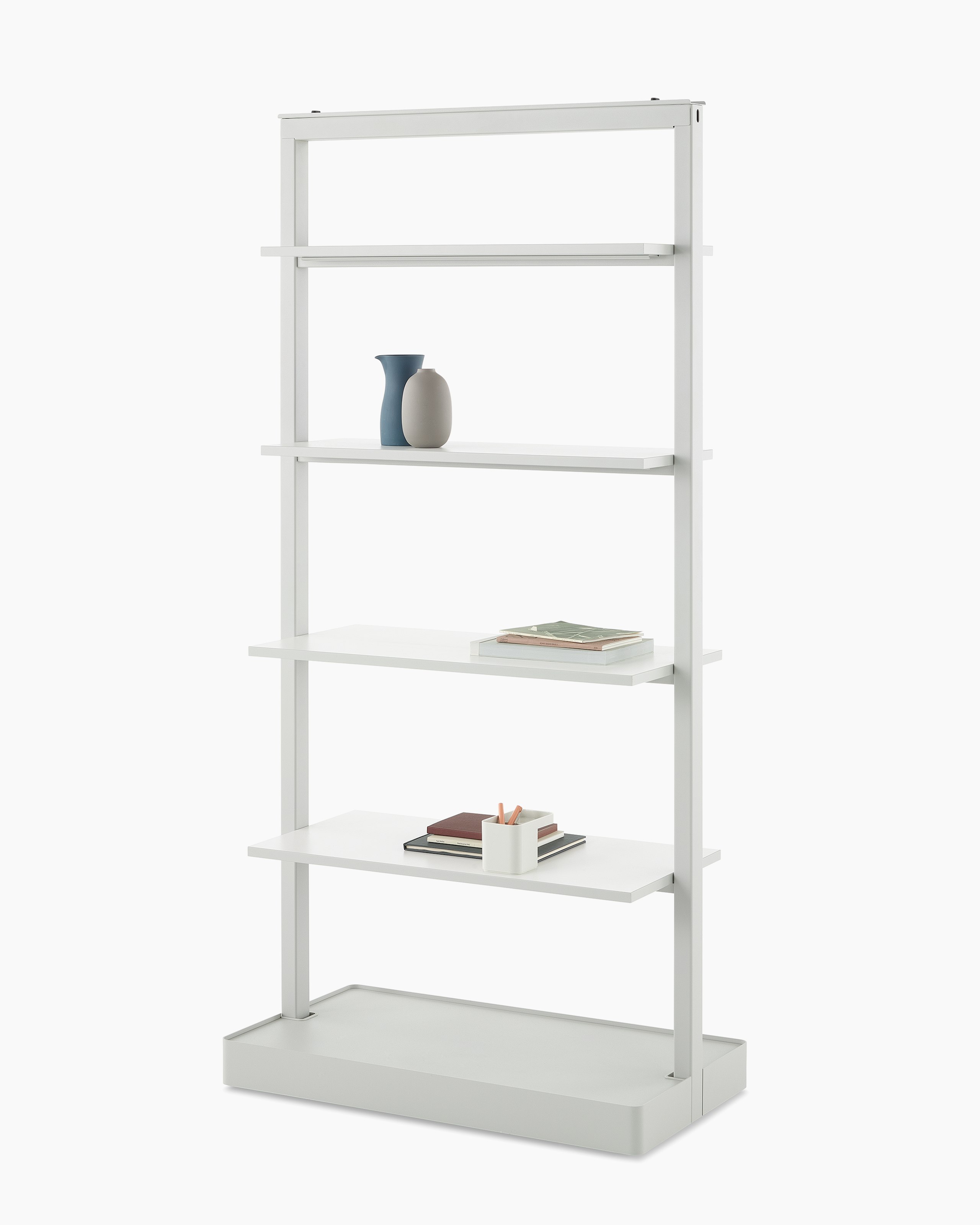A gray OE1 Agile Wall with full shelves and styling elements, viewed from an angle.