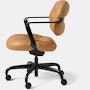 Side view of a Morrison Hannah chair with a black frame and base with fixed arms and light brown leather upholstery.