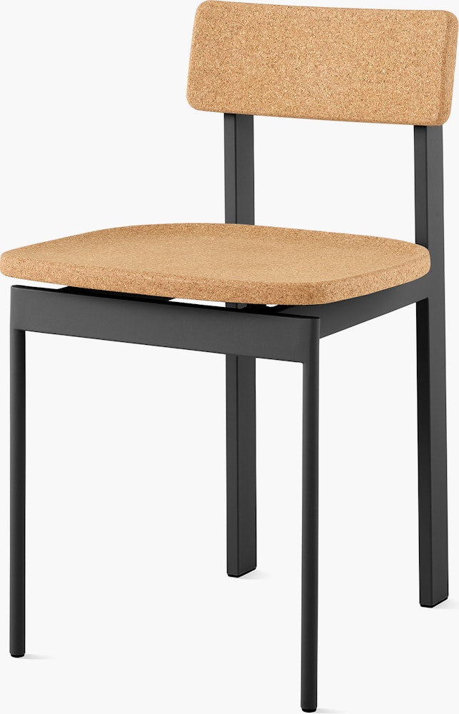 A cork Betwixt Chair with a black frame.