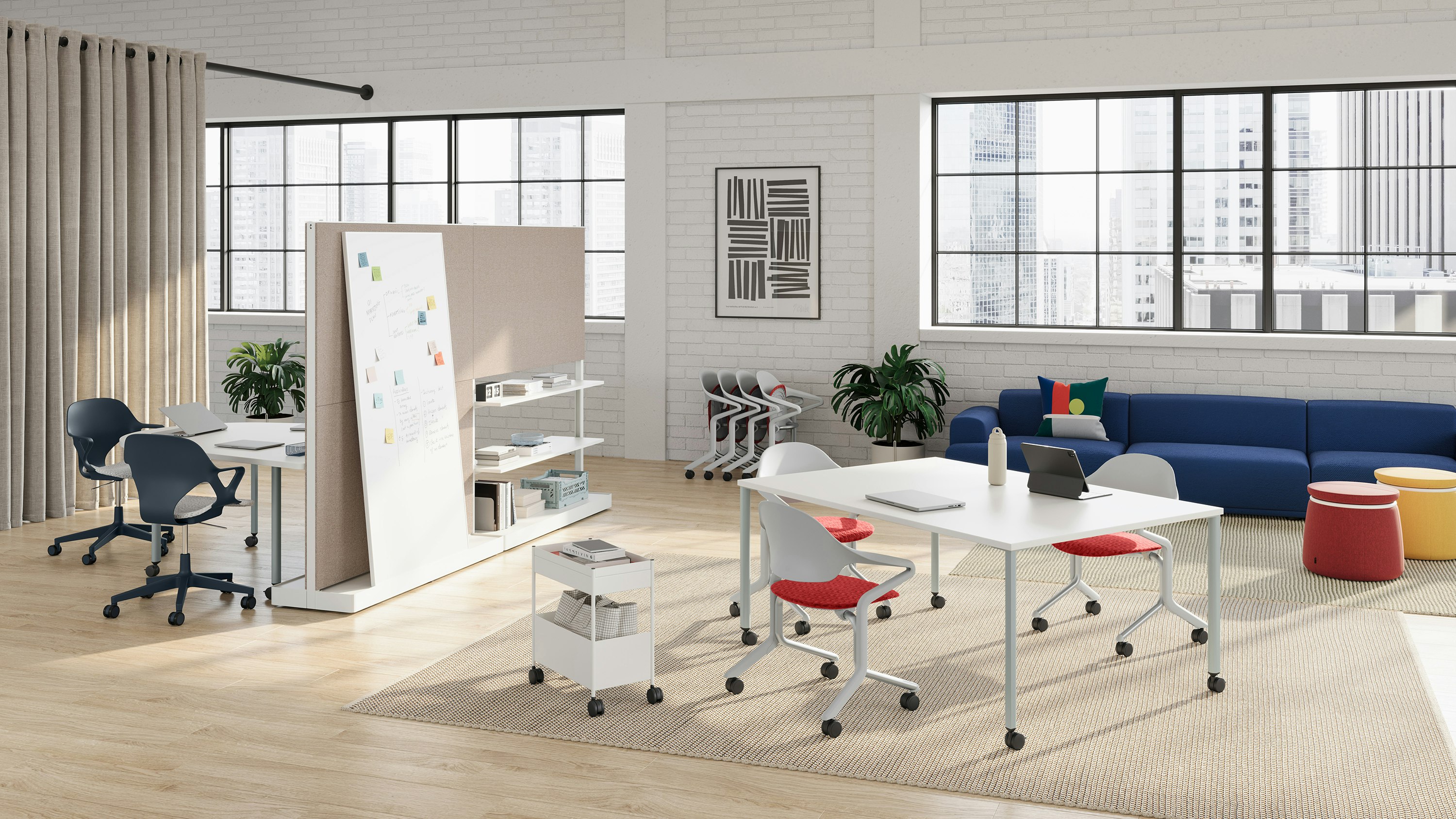 Fuld Chairs in alpine with a canyon seat pad are featured in a workshop setting with Zeph Chairs in nightfall and a selection of OE1 Workspace Collection products including OE1 Project Table, OE1 Agile Wall and OE1 Huddle Table.