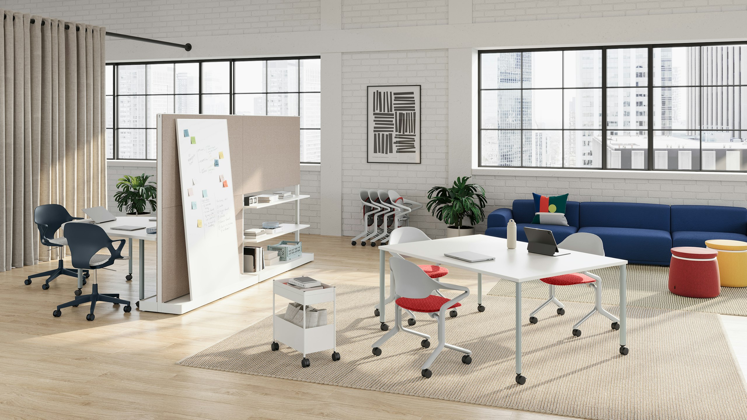 Fuld Chairs in alpine with a canyon seat pad are featured in a workshop setting with Zeph Chairs in nightfall and a selection of OE1 Workspace Collection products including OE1 Project Table, OE1 Agile Wall and OE1 Huddle Table.
