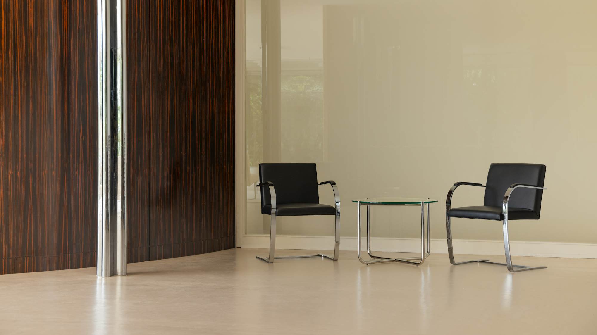 Brno Chairs and MR Table by Macassar ebony wall