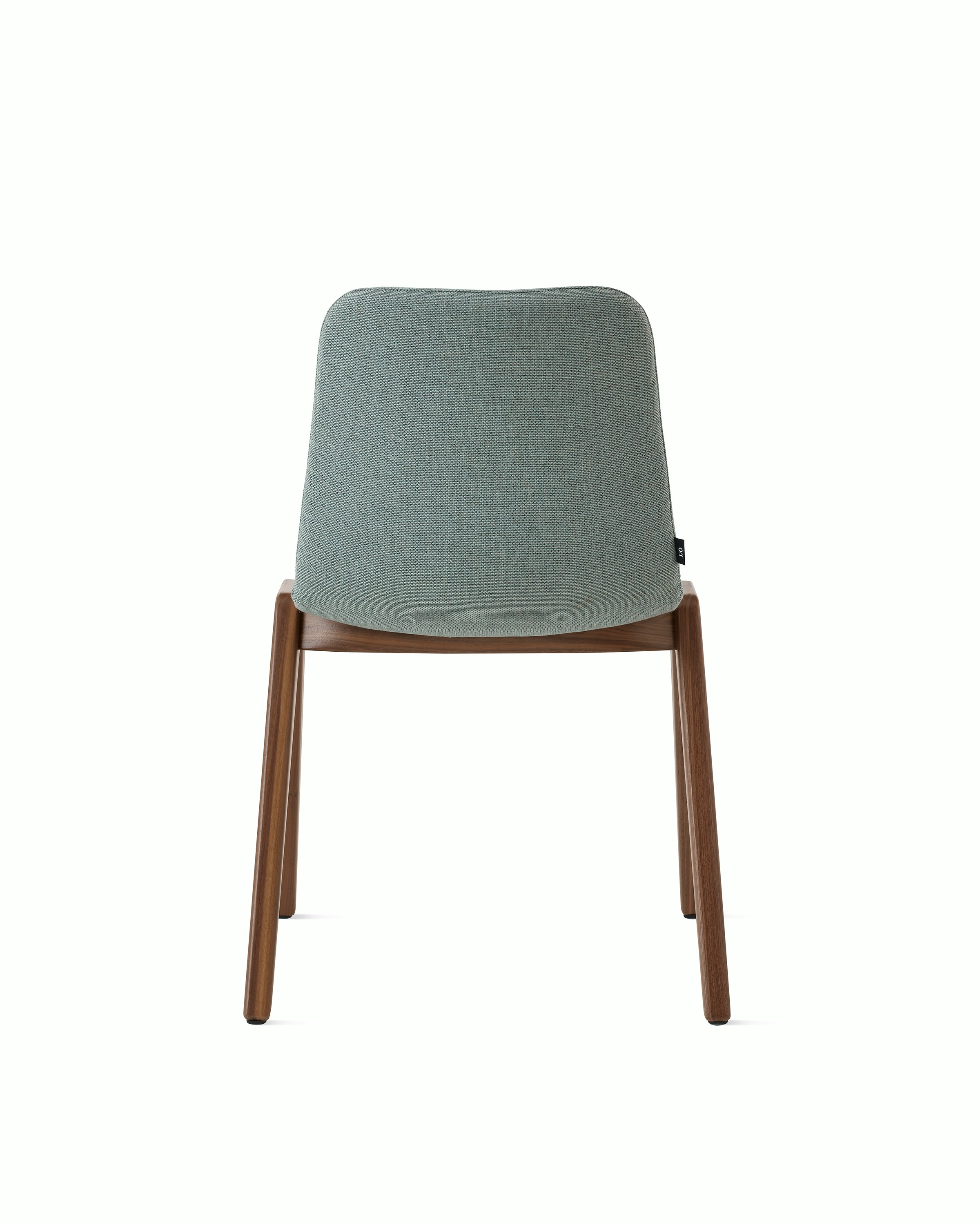 White sweep of Viv wood chair with seafoam fabric and 4 leg walnut wood base