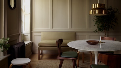 A sunlit dining space featuring furniture showcasing Edelman leather