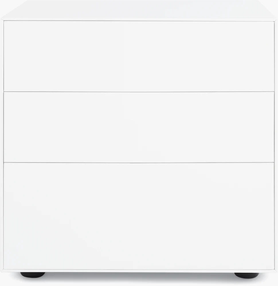 White three-drawer dresser with black feet