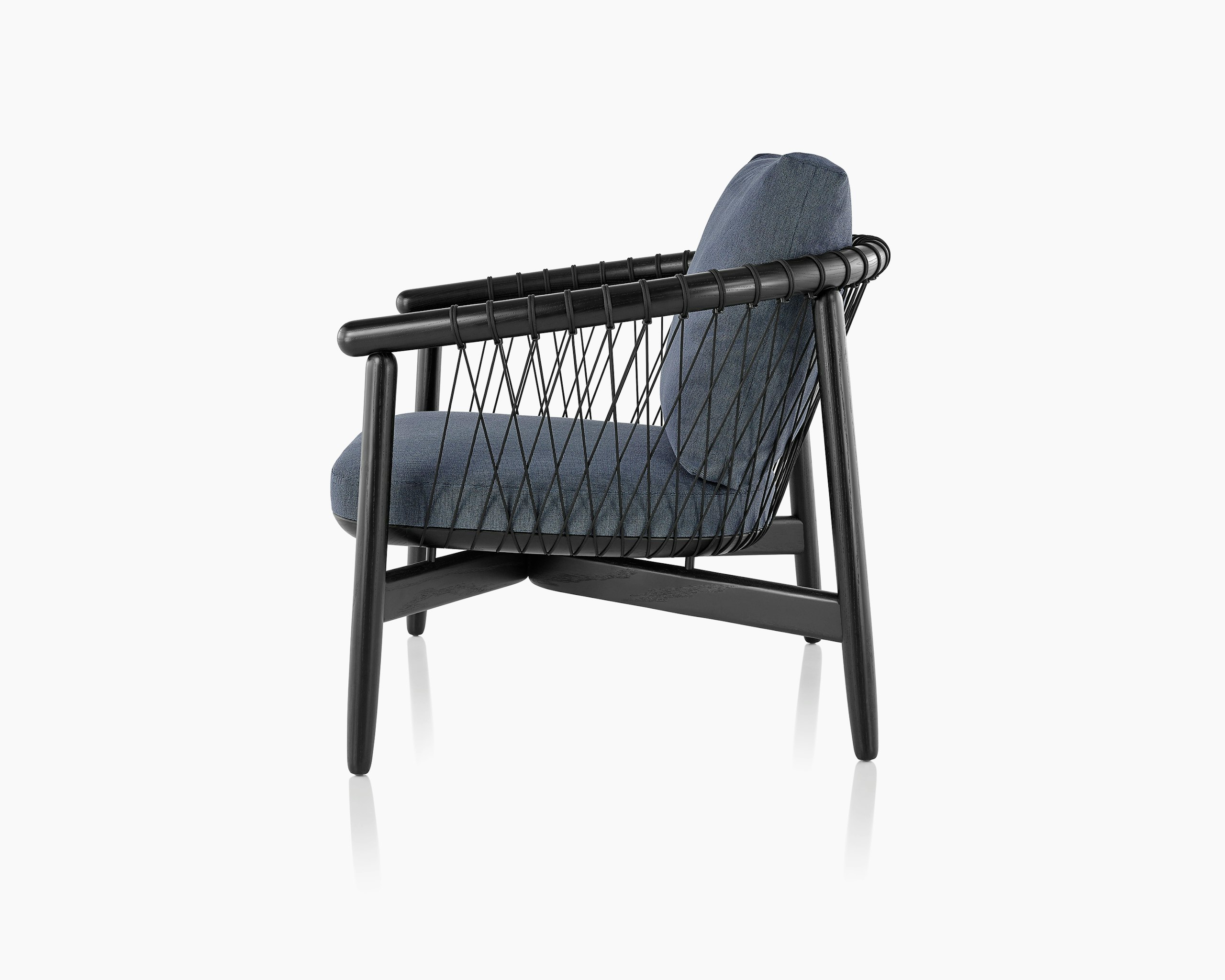 Side view of a Crosshatch lounge chair with dark blue fabric and a black wood frame.