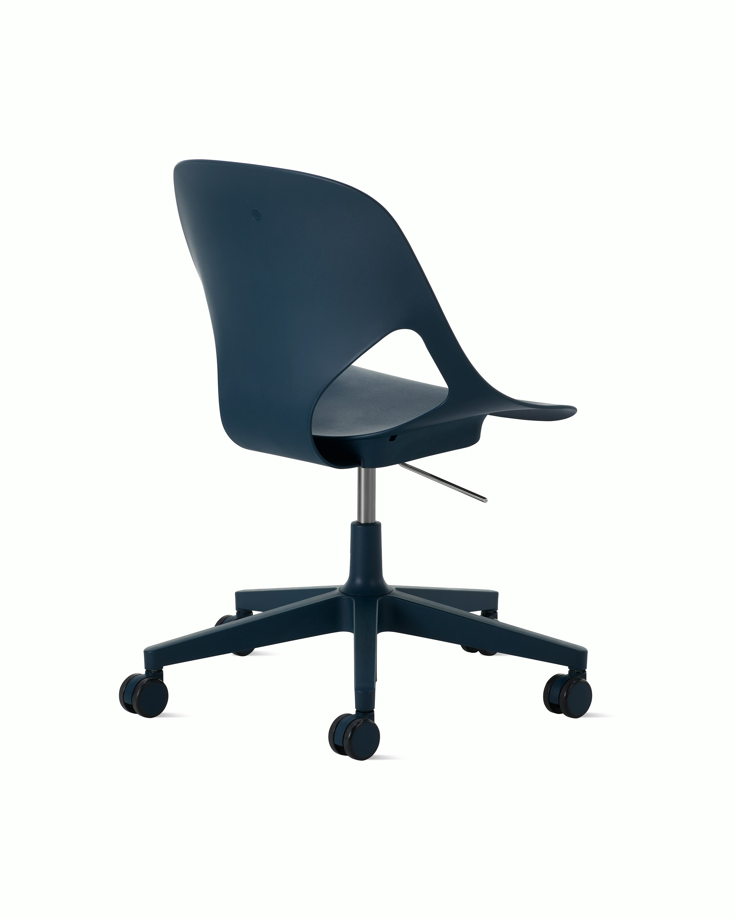 Rear angle view of a dark blue armless Zeph chair.