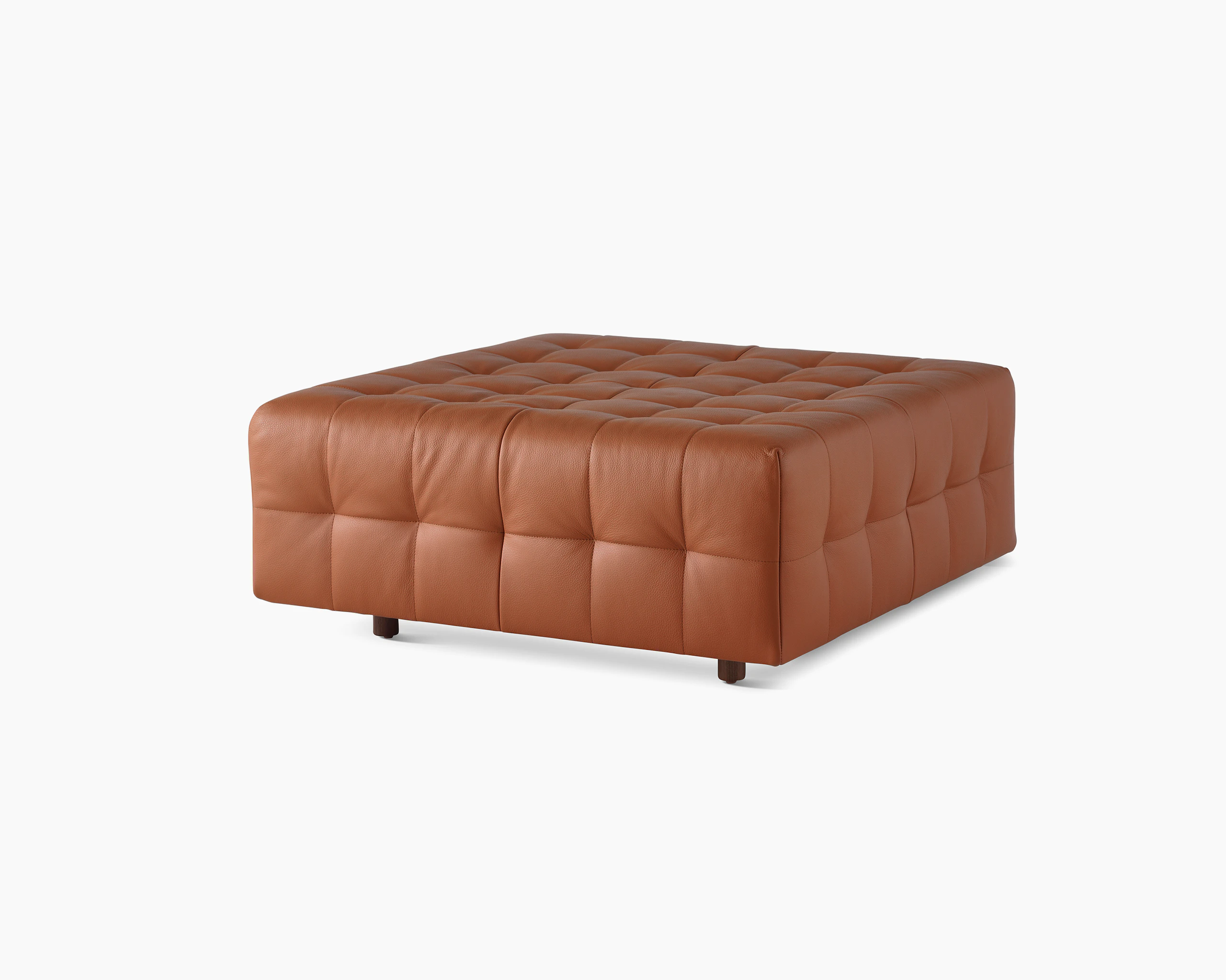A Rapport ottoman upholstered in leather.