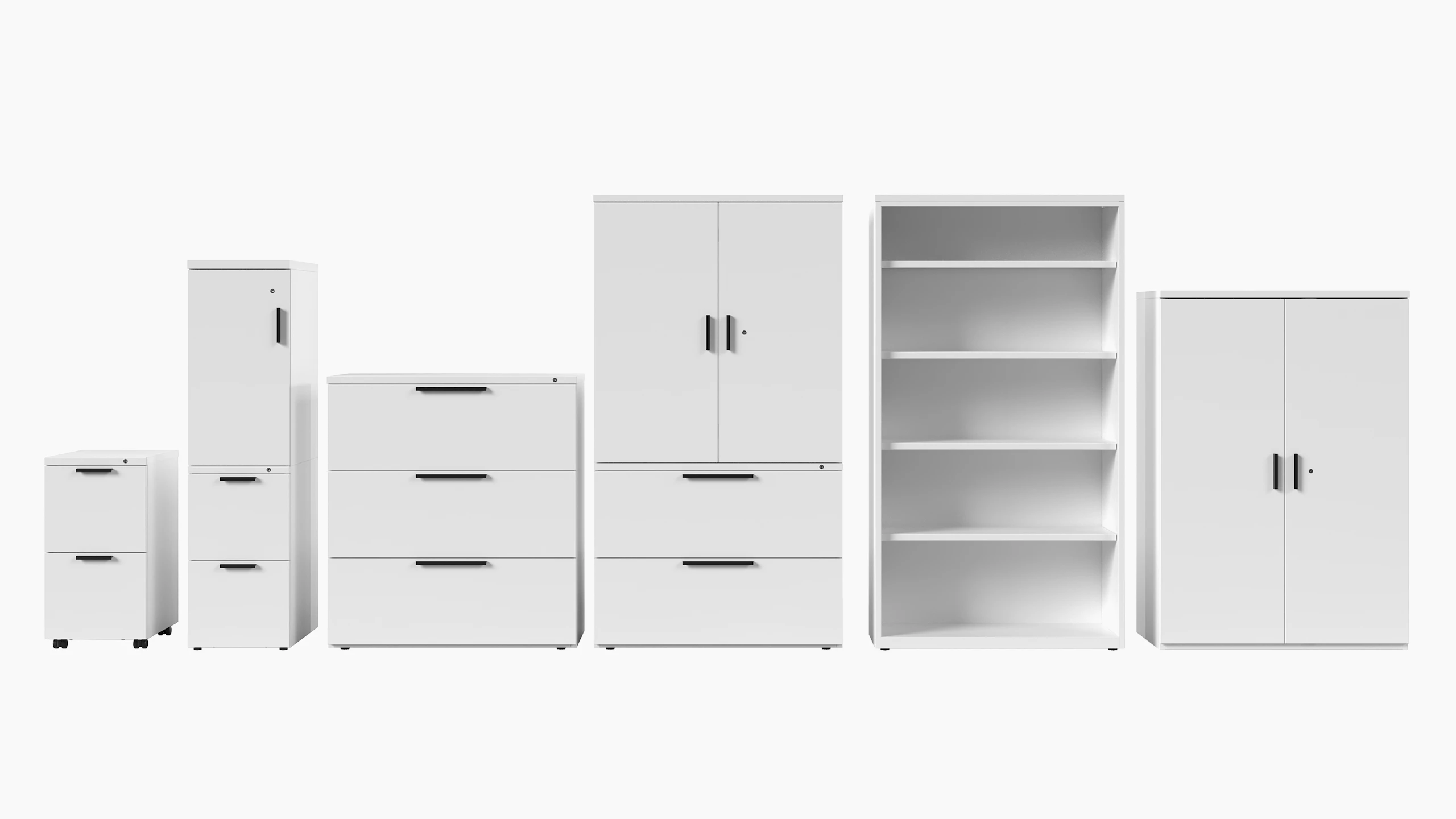 Six white Series 2 storage units with black template pulls, viewed from the front.