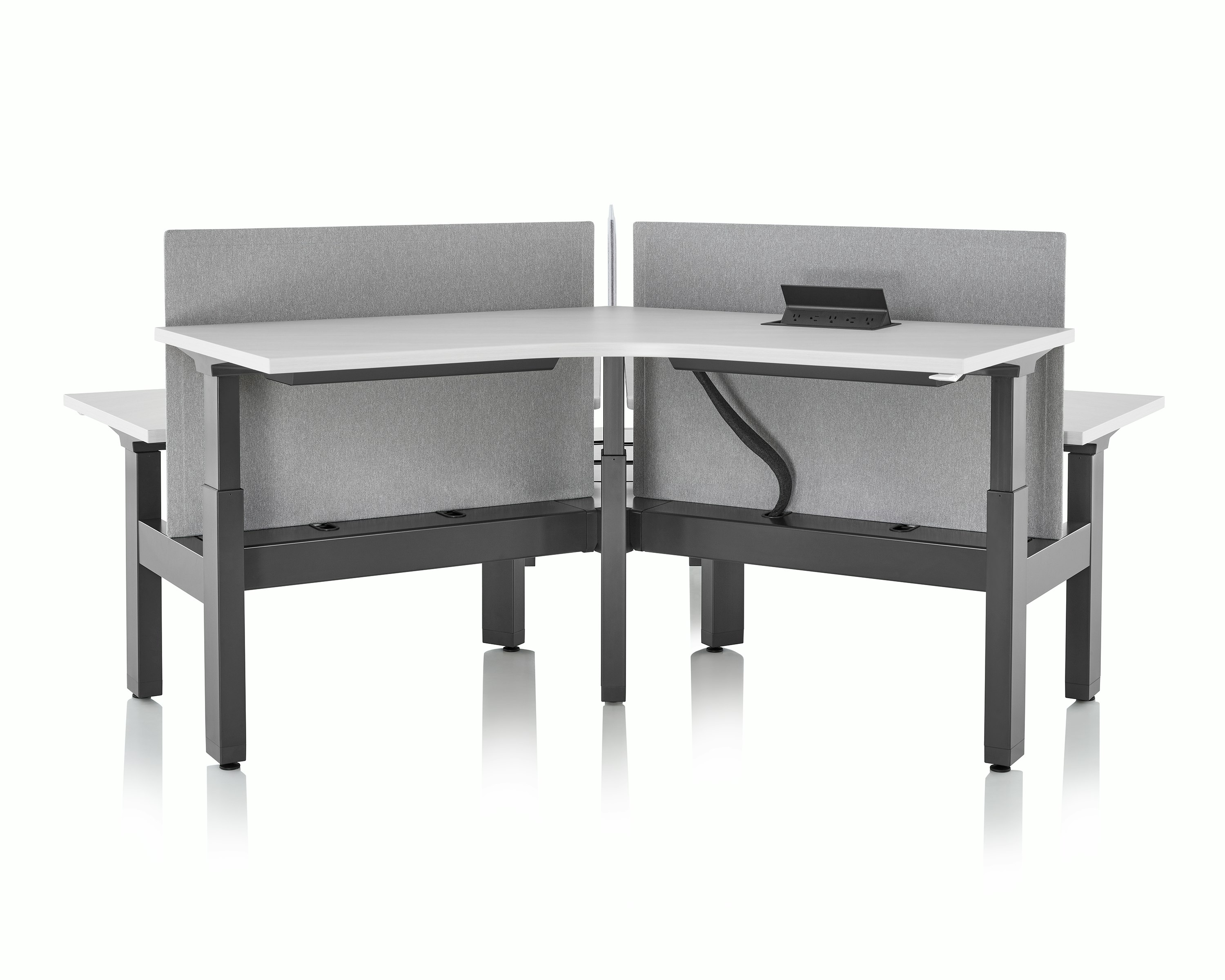 Front view of standing desk system, Renew Link, that shows the surface power, Logic 1000, open on the work surface.