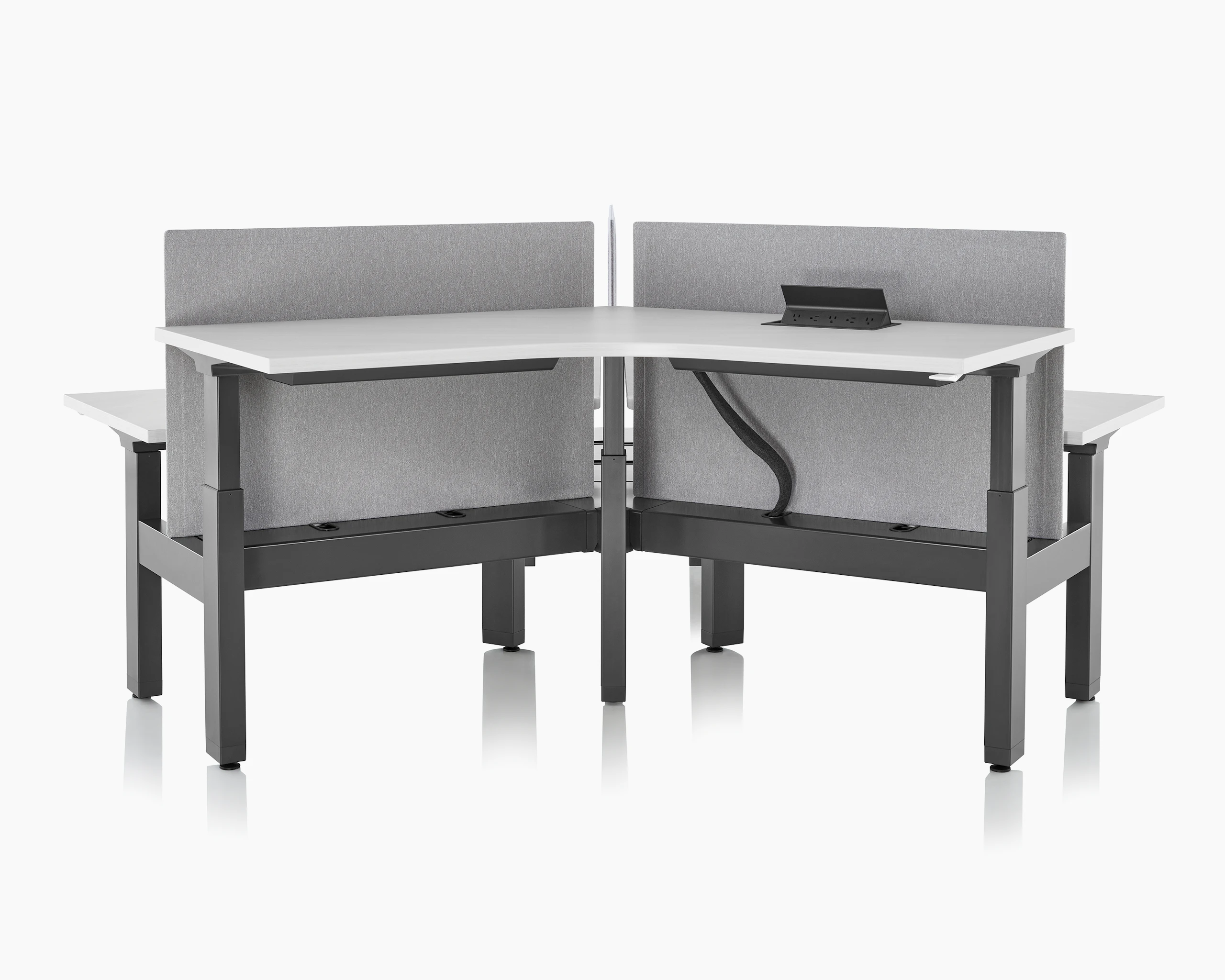 Front view of standing desk system, Renew Link, that shows the surface power, Logic 1000, open on the work surface.