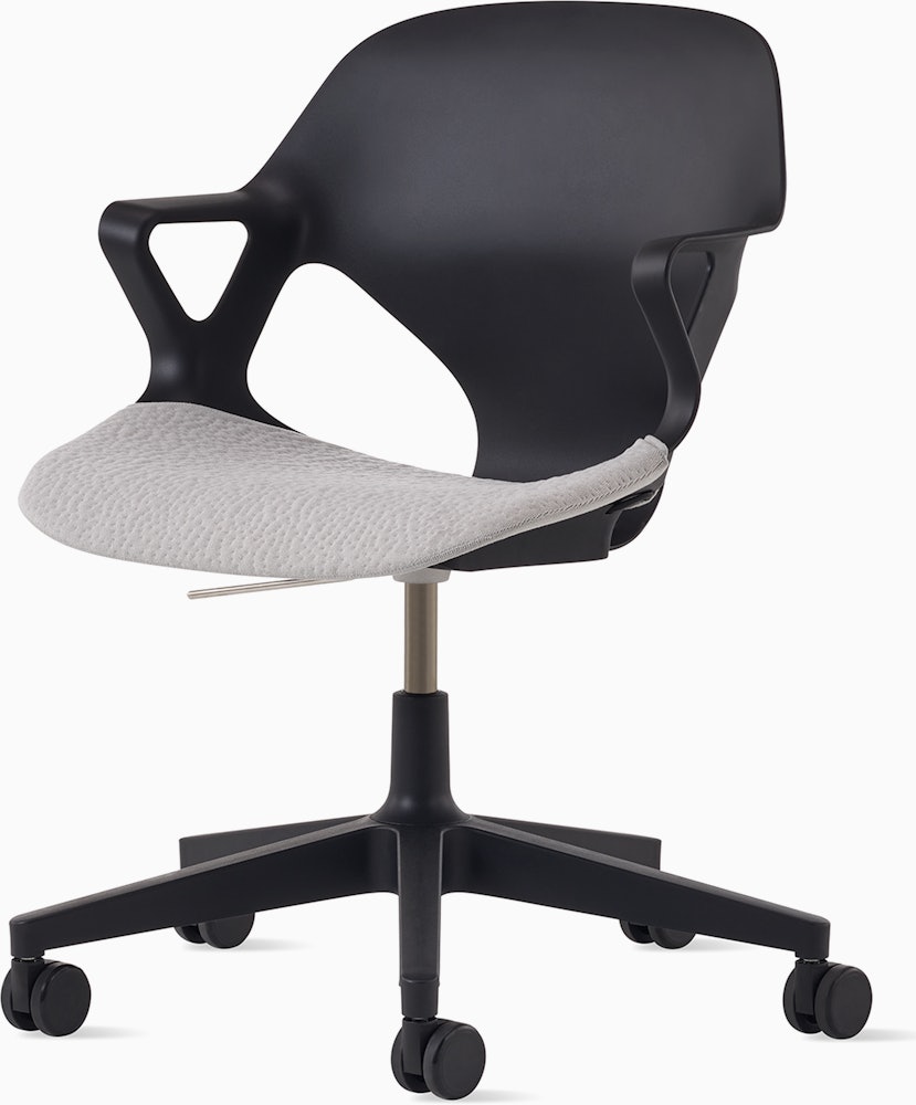 Front angle view of a black Zeph chair with fixed arms and a light grey seat pad.