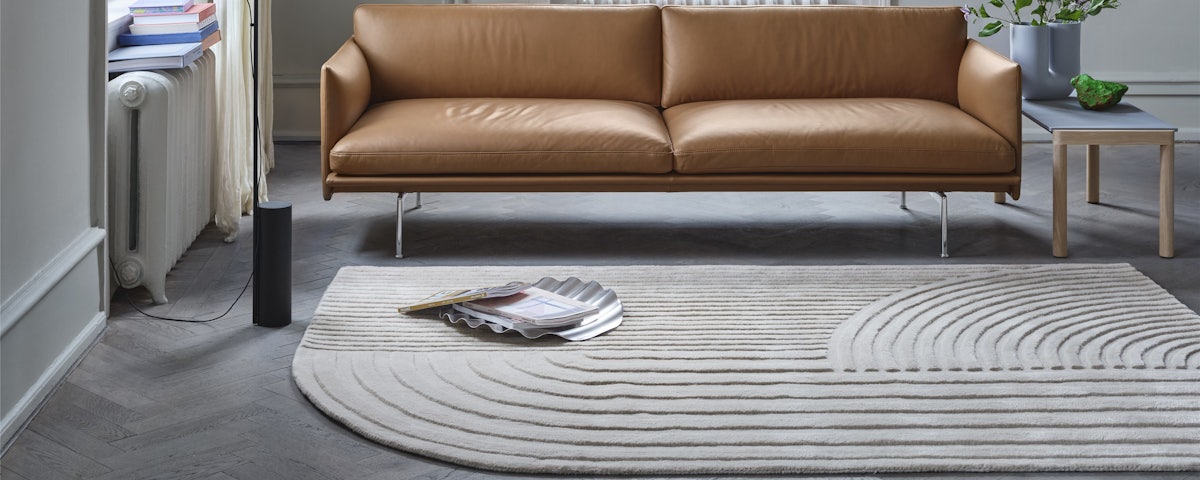 Relevo Rug and Outline Sofa in a living room setting