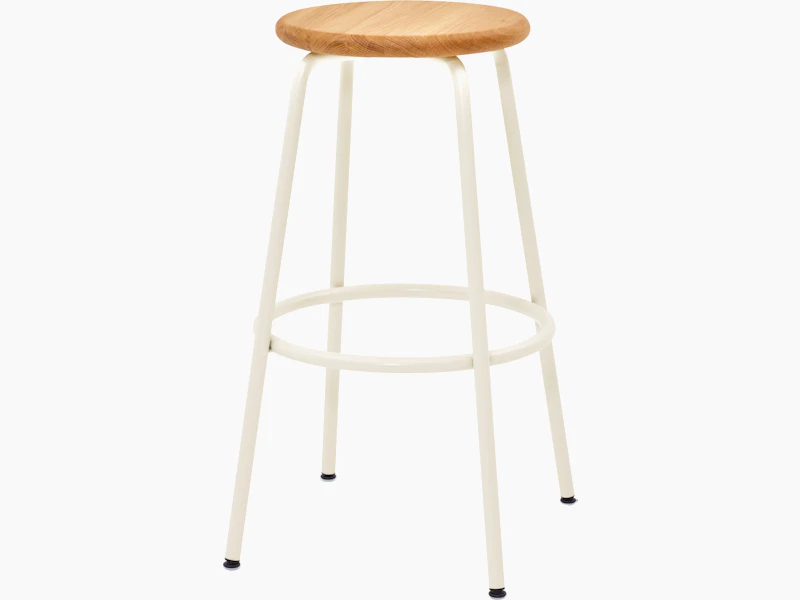 A Penny Stool with a cream base and oak seat.