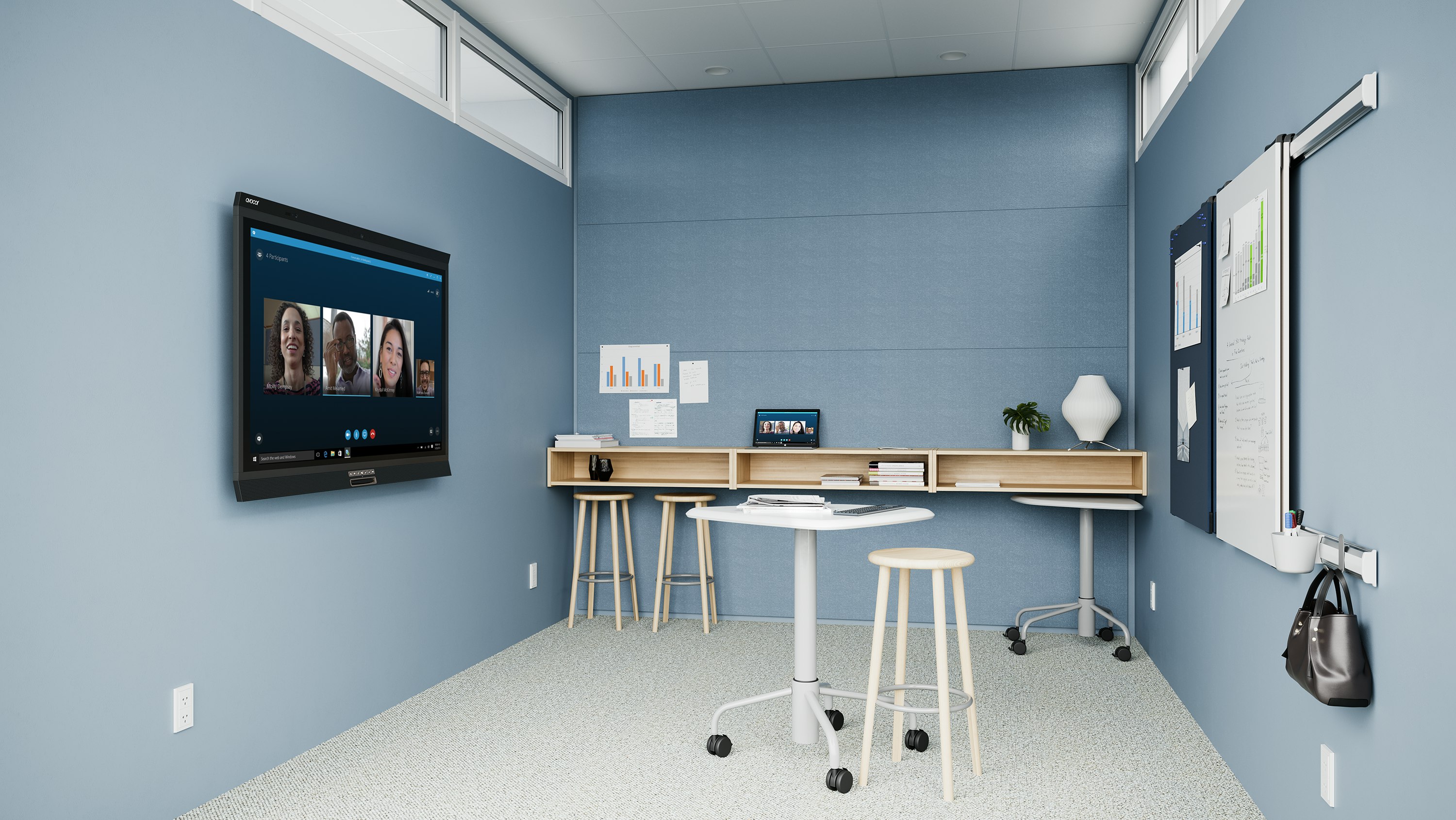 A light blue project room with an Intent Solution mobile, height-adjustable table and Mattiazzi Solo Stools, featuring technology from Logitech.