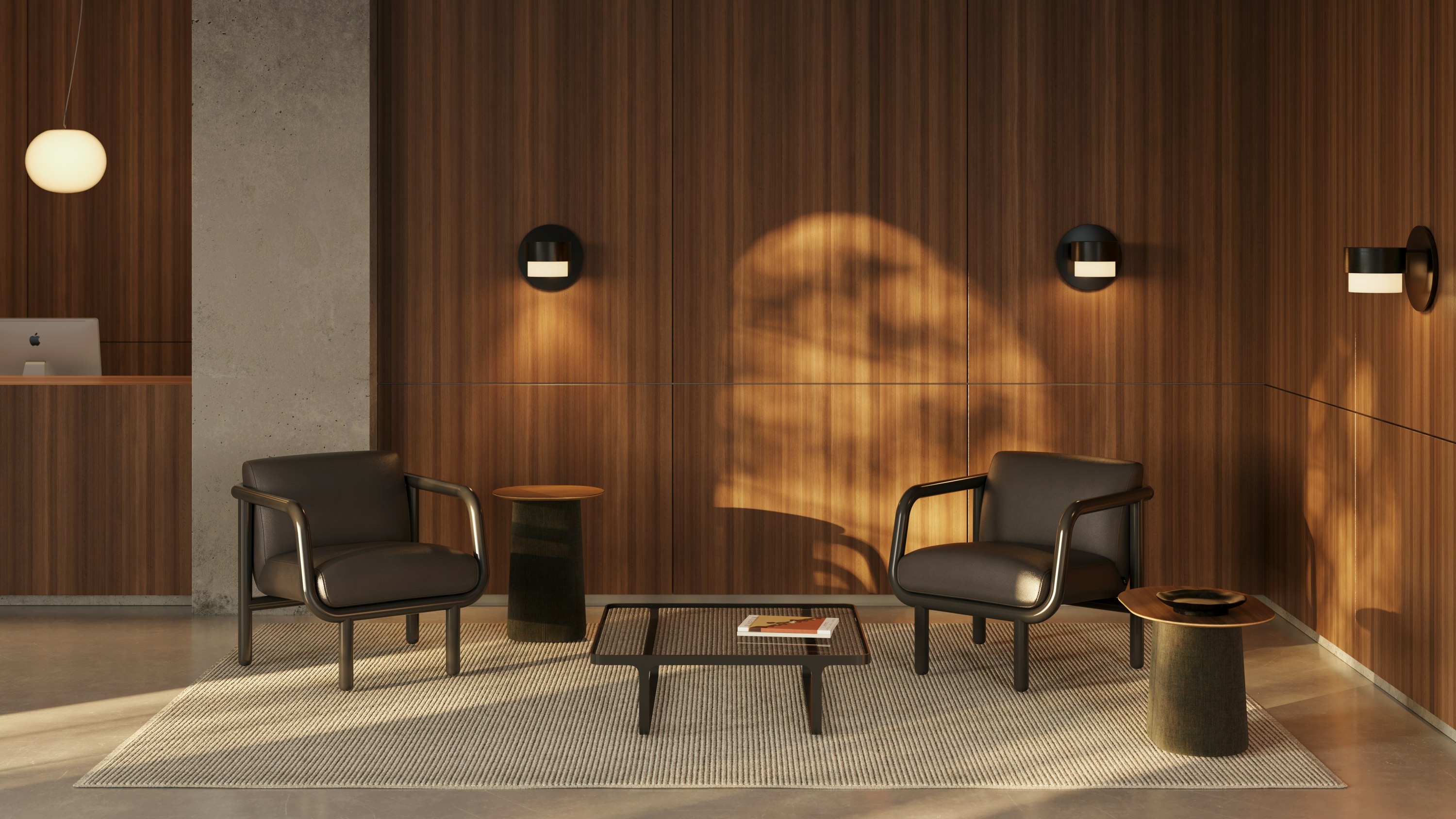 Two Percy chairs with leather upholstery in a wooden panelled reception area.