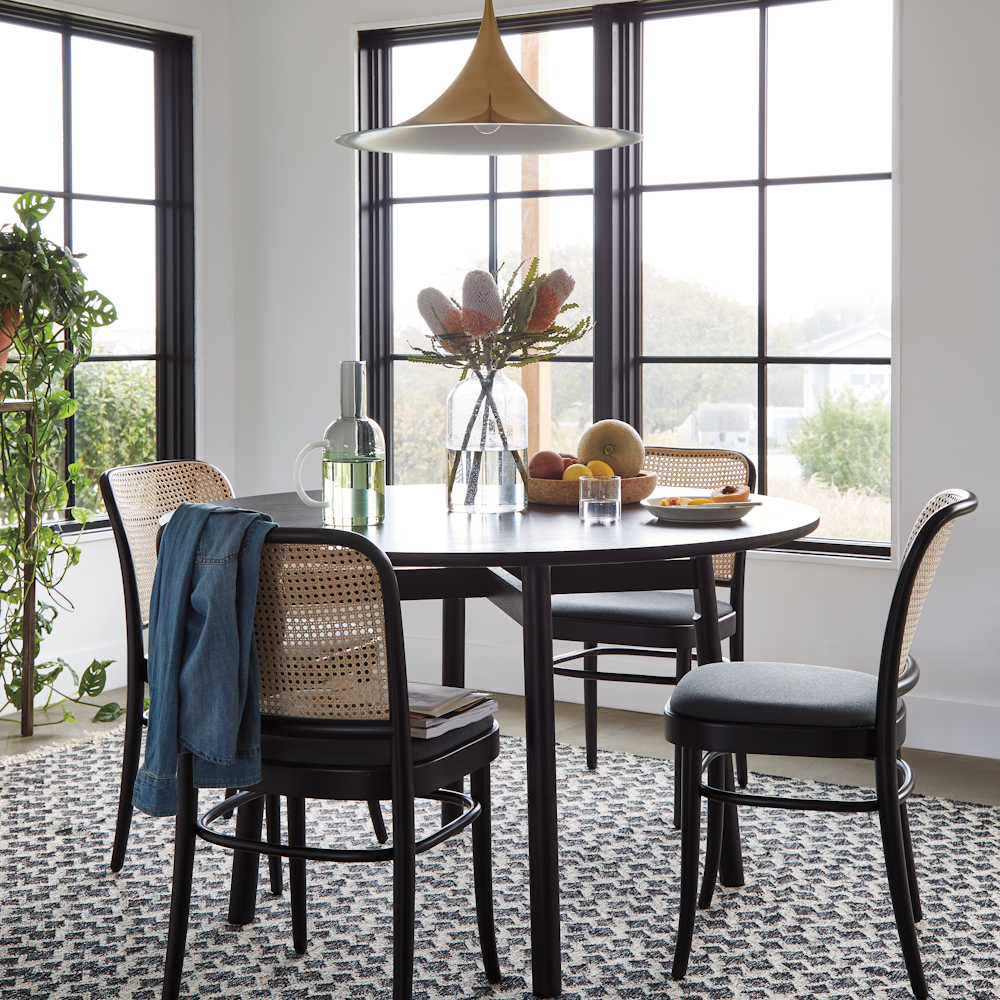 Kigumi Table, Hoffman Wicker Chairs and Semi Pendant Lamp in a dining room setting