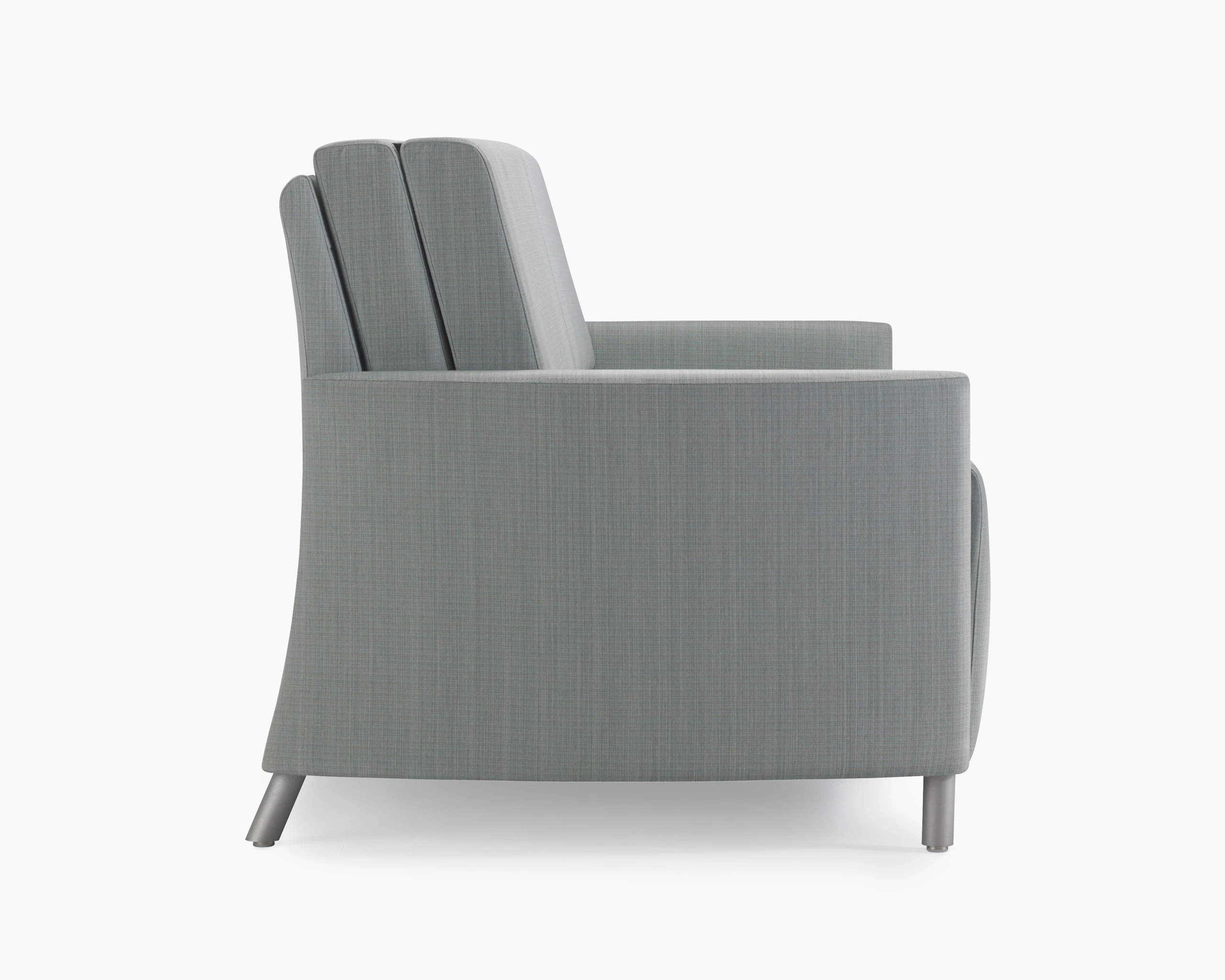 A side view of a Pamona Flop Sofa in gray textile with metal legs.